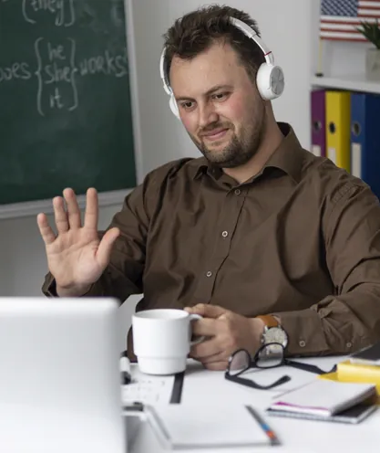 Teacher addressing students through a laptop