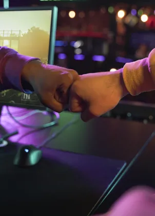 Gaming teammates celebrating together