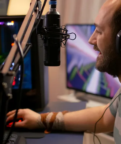 Gamer wearing a headset at a computer