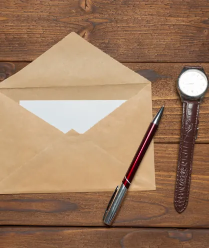 Paper notice in an envelope on a desk