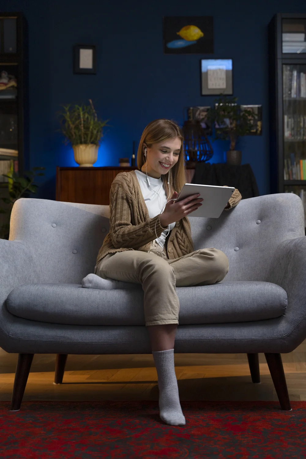 A viewer enjoying a video on a tablet at home.