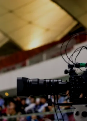 Broadcast camera filming football