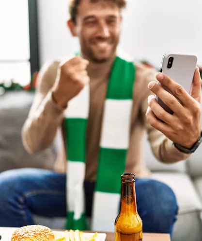 Fan viewing a sports event on a phone