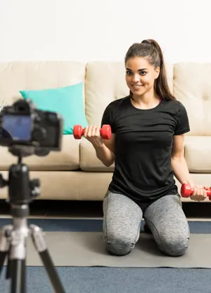 Fitness creator filming a class