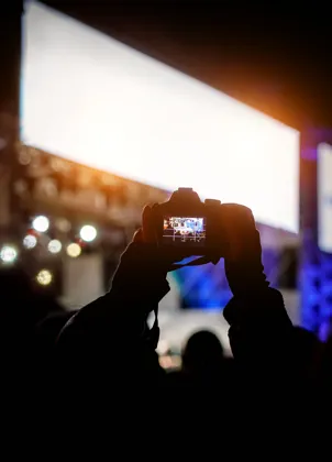 Attendee recording a live concert