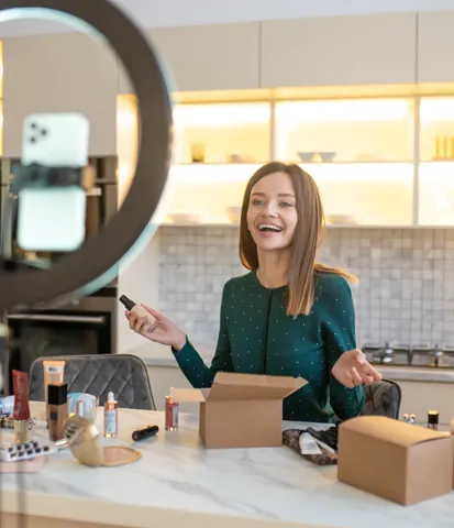 Seller demonstrating beauty products to a phone camera