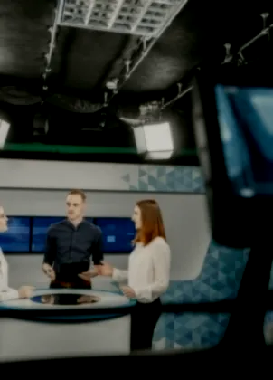 Production camera trained on television presenters