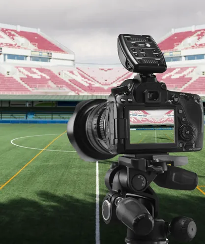 Camera filming a football match