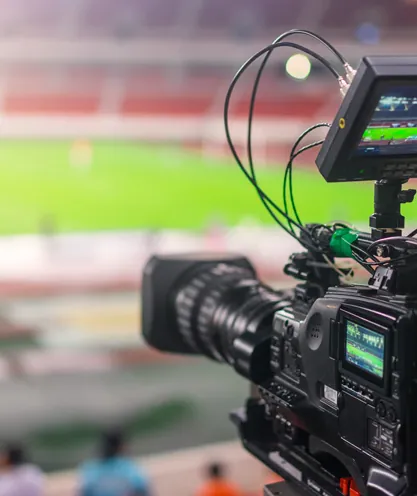 Broadcast camera at a football match