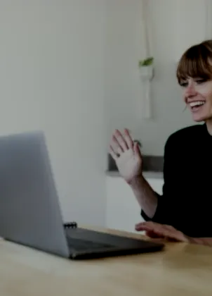 Coach greeting clients on a video call