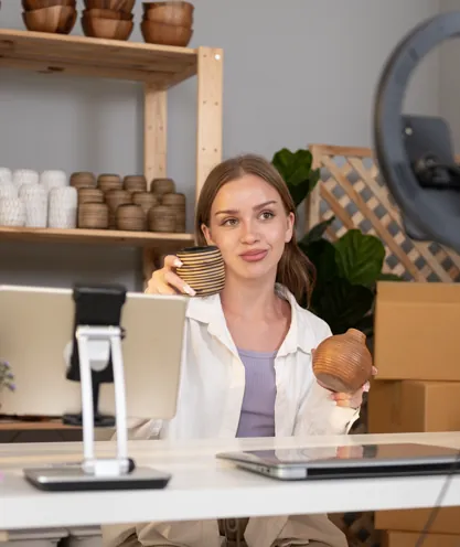 Shop owner presenting products on camera