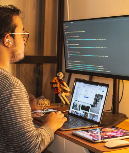 Developer testing desktop and mobile website layouts