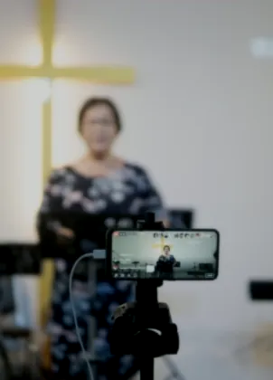 Camera recording a live worship broadcast