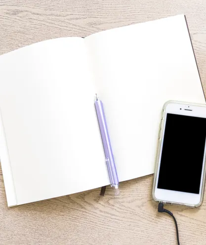 Planner and phone used to schedule shows and manage time
