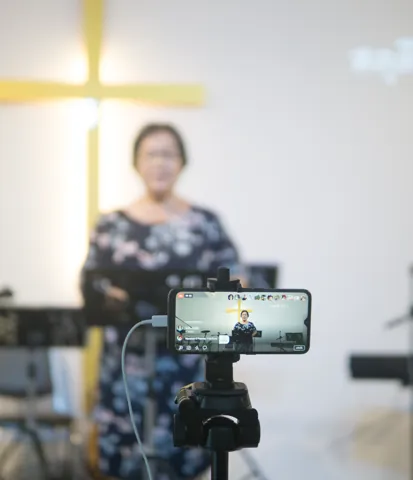 Camera recording a worship broadcast