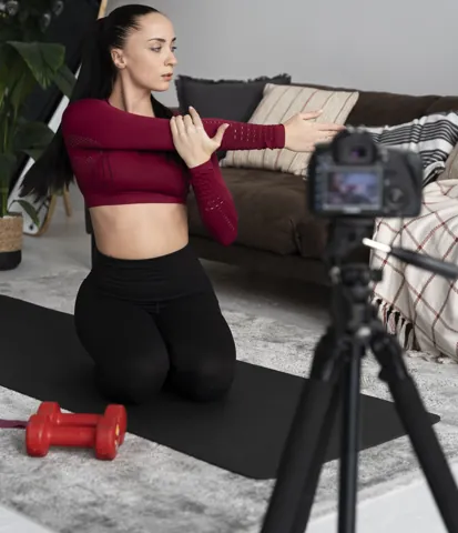 Fitness instructor recording an exercise class