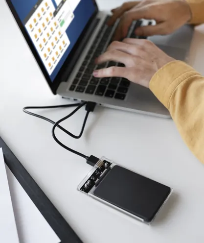 External drive connected to a laptop for video storage