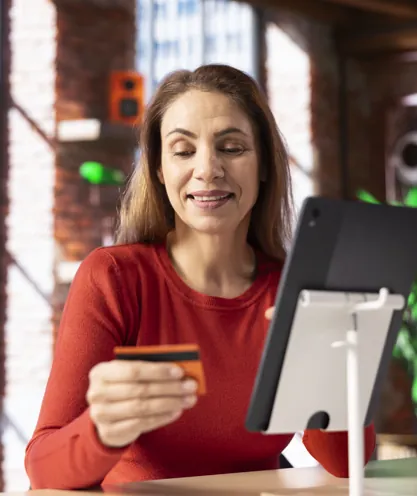 Viewer paying online with a card and tablet