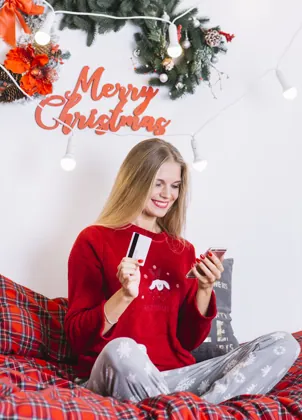Viewer holding a payment card and phone