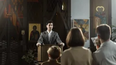 a pastor preaching to a small congregation in a church